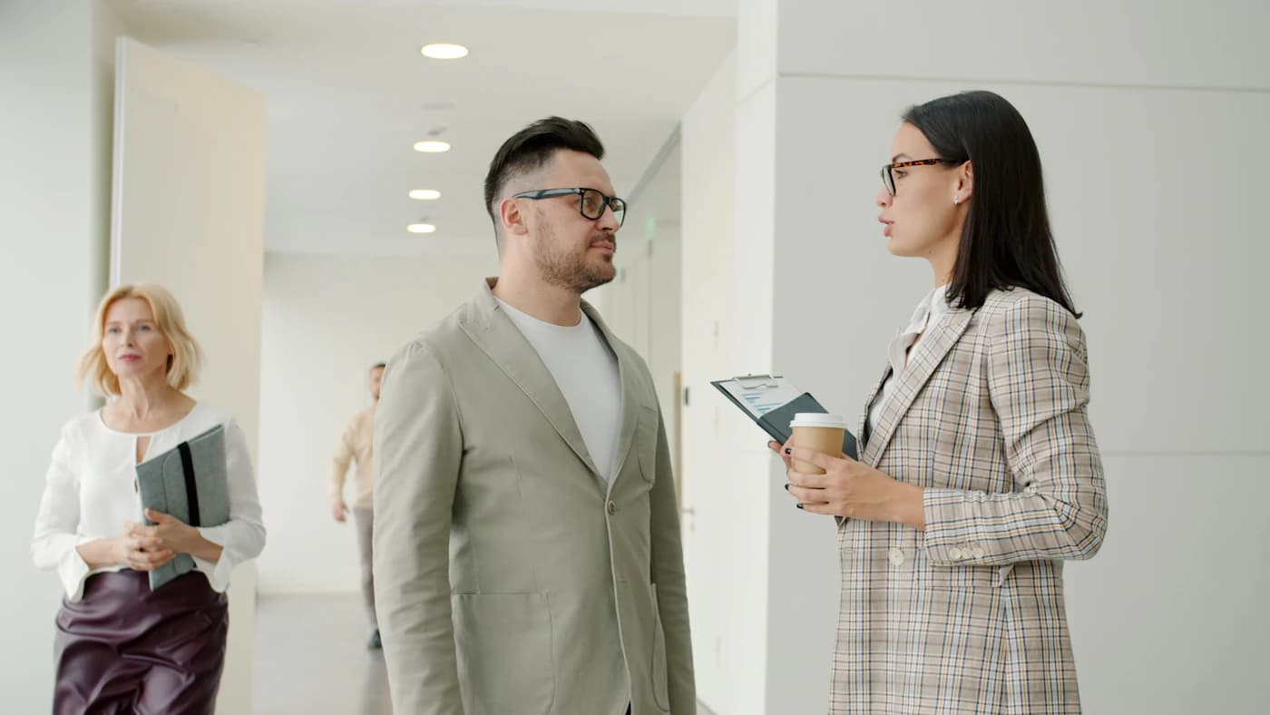 Colleagues talking in an office